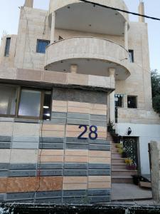 a building with a number on the front of it at Elegant housing in Jerash