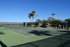 a tennis court with palm trees in the background at Very relaxing San Felipe Vacation Home with New Decor and Upscale Amenities in San Felipe