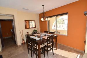 a dining room with a table and chairs at Super close to the beach house for rent in San Felipe - FREE WiFi + Golf Pass in La Ponderosa