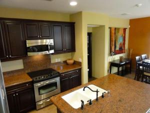 a kitchen with a sink and a stove top oven at Super close to the beach house for rent in San Felipe - FREE WiFi + Golf Pass in La Ponderosa