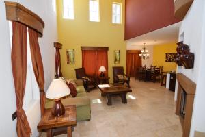 a living room with a couch and chairs and a table at San Felipe Ultra Deluxe Elegance with Spectacular Sea Views in Playa El Paraíso