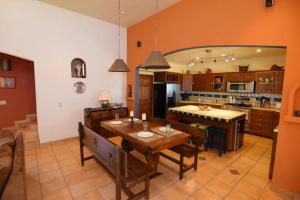 a large kitchen with a table and chairs in it at El Dorado Ranch San Felipe Rental Home W/ In Home WiFi in Playa Unión