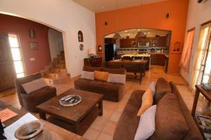 a living room with couches and a dining room at El Dorado Ranch San Felipe Rental Home W/ In Home WiFi in Playa Unión +42 photos
