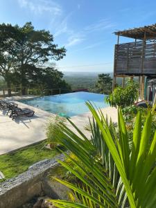 a view of a swimming pool from a house at ADA MARINA, hotel campestre con la mejor vista a Cartagena in Turbaco