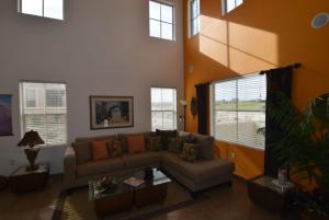 a living room with a couch and a large window at El Dorado Paradise #434 in San Felipe