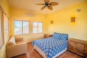 a bedroom with a bed and a ceiling fan at Casa Melissa - 3 Bedroom Playa de Oro San Felipe rental home in San Felipe