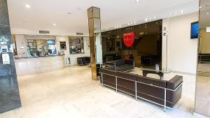 a store lobby with a red face on the window at Corrientes Plaza Hotel in Corrientes