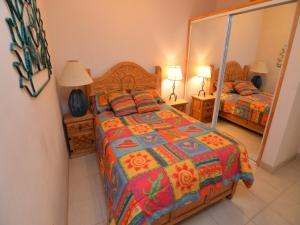 a bedroom with a bed and a mirror at CASA MAGERS - El Dorado Ranch San Felipe Rental Home in San Felipe +19 photos
