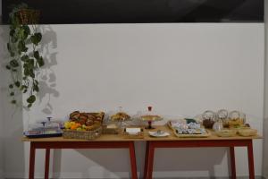 a table with many baskets of food on it at Cocos Park Ischia in Ischia