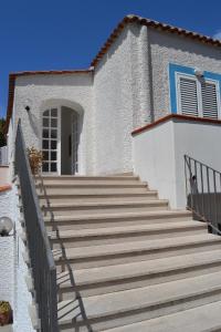 a set of stairs leading to a house at Cocos Park Ischia in Ischia