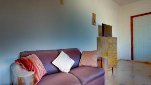 a living room with a couch and a television at El Dorado Ranch Rental - Judy`s Casita in San Felipe