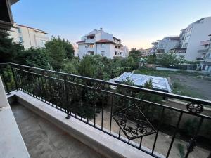 a balcony with a view of a city at Vqra Sarafovo in Burgas