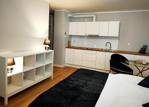 Posteľ alebo postele v izbe v ubytovaní Hugo Star Apartments