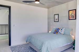 a bedroom with a bed and a ceiling fan at City Apartment NEW 3Bed Highgate Hill in Brisbane