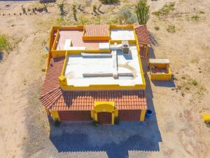an overhead view of a house with a yellow roof at 2BR /2BA Family Vacation Home with WiFi in Playa Hawaii