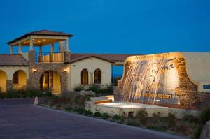 a home with a fountain in front of a building at 3-bedroom Pool Side Vacation villa in San Felipe