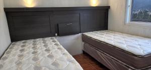 a bedroom with two beds and two cabinets at Cabañas San José Chotuj 