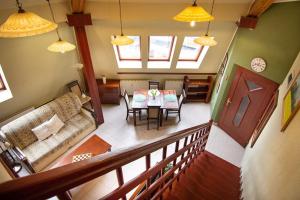 a living room with a couch and a table at Zsófia Apartman in Veszprém