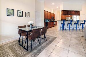 a dining room and kitchen with a table and chairs at Cozy Home on the outskirts of Tallahassee in Tallahassee