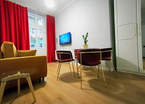 Televízia a/alebo spoločenská miestnosť v ubytovaní Hugo Star Apartments
