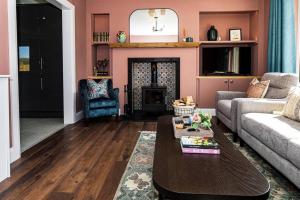 a living room with a couch and a table at The Halt @ The Halfway House Country Pub in The Sheddings