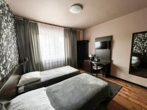 Tempat tidur dalam kamar di Noclegi Pod Lasem