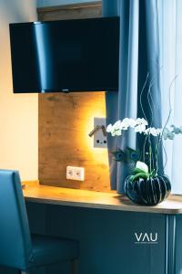 TV a/nebo společenská místnost v ubytování Vau + 9 fotografií
