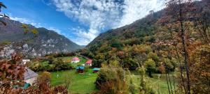 a view of a valley with mountains in the background at EtnoPetra in Mojkovac