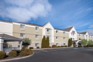 a large apartment building with a parking lot at Candlewood Suites Elkhart, an IHG Hotel in Elkhart