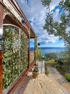 a stone house with a view of the ocean at Bella vista with jacuzzi in Omiš