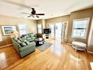 a living room with a couch and a table at Beach Block 4 Bedroom with POOL in North Wildwood
