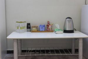 a white table with a blender on top of it at شقة خاصة للعائلات فقط in Medina
