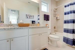 a white bathroom with a sink and a toilet at Canyon Lake Home Rental Boating, Patio and More! in Canyon Lake +23 photos