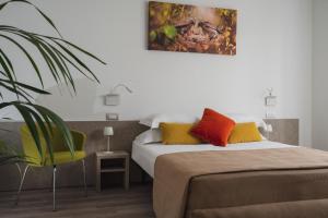 Postel nebo postele na pokoji v ubytování Nido Suite & Apartments
