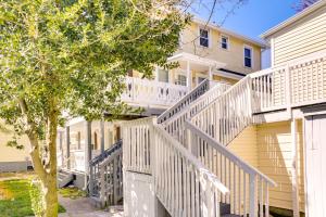 a house with white stairs and a tree at Ocean City Retreat Near Theme Parks, Walk to Beach in Ocean City