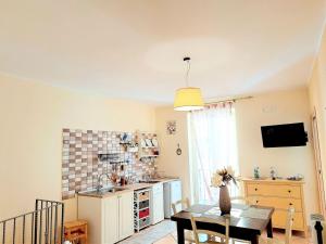 A kitchen or kitchenette at Superior Apartment le Case del Sole Licata
