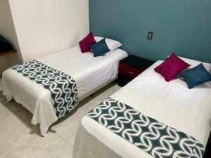 A bed or beds in a room at Departamentos Madera