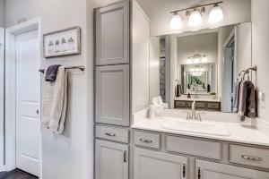 a bathroom with a sink and a mirror at Spacious Home with Patio Near Fishers! in Fishers +19 photos