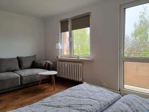 Ένα ή περισσότερα κρεβάτια σε δωμάτιο στο Apartament Żółkiewski