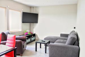 TV a/nebo společenská místnost v ubytování MAXIM APARTMENT