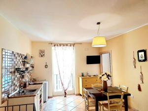 A television and/or entertainment centre at Superior Apartment le Case del Sole Licata