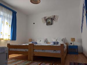 Postel nebo postele na pokoji v ubytování Casa Traditionala Clisciova