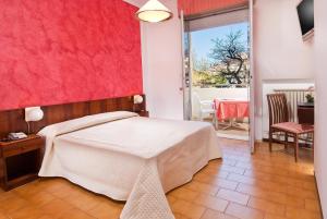 Postel nebo postele na pokoji v ubytování Hotel Le Querce