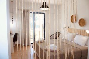 Кровать или кровати в номере Afroditi Junior Suites