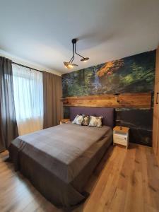 Postel nebo postele na pokoji v ubytování Apartamenty Stara Wisła