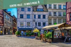 a picture of a street in a city with buildings at La Maison des Plantes, charmante, atypique et cosy pour 4 personnes avec parking et jardin in Rouen