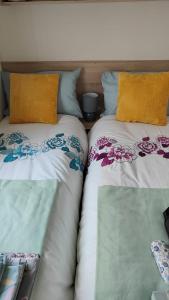 two beds sitting next to each other next to each other at Chainbridge in Selsey