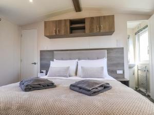 Voodi või voodid majutusasutuse Honeysuckle Lodge toas