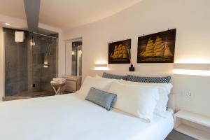 Postel nebo postele na pokoji v ubytování Torre a Mare Porto Venere + 46 fotografií