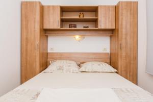 Postel nebo postele na pokoji v ubytování Apartments Viljac